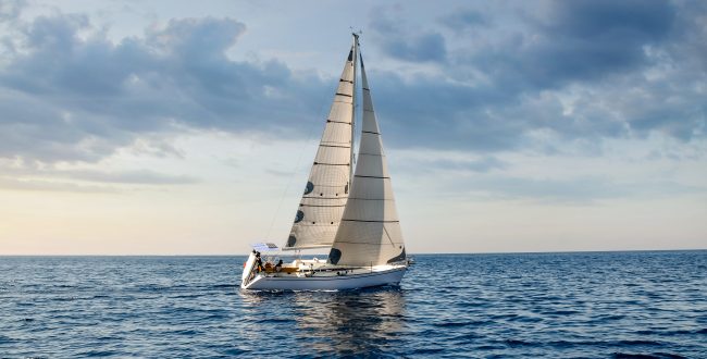 Close Up Sailboat Sailing Under A Beautiful Sunset