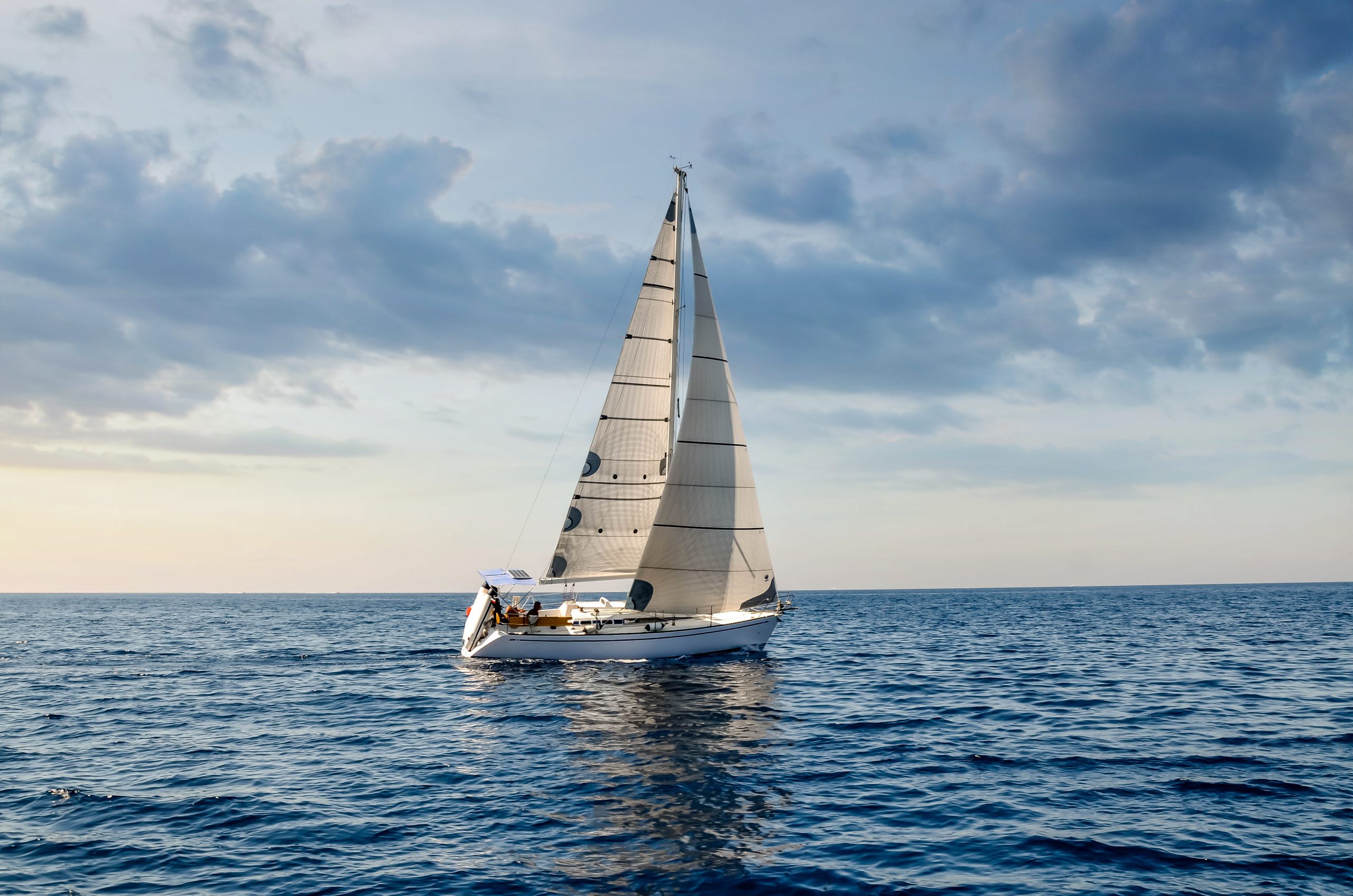 Close Up Sailboat Sailing Under A Beautiful Sunset